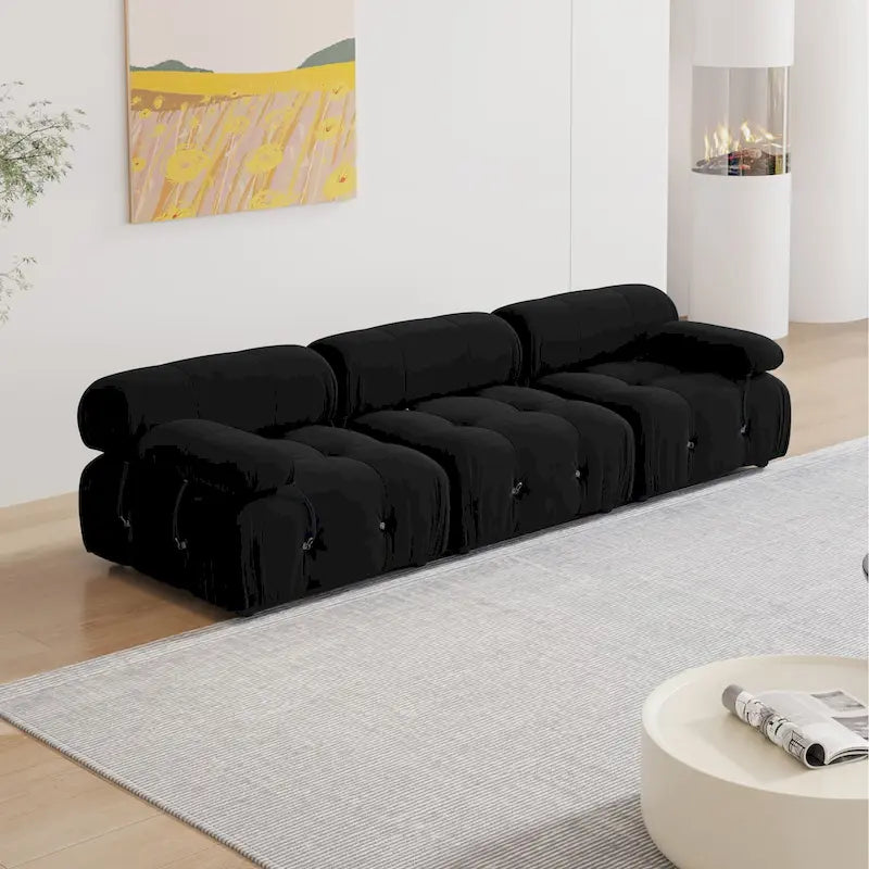 Sofá seccional tapizado en terciopelo negro