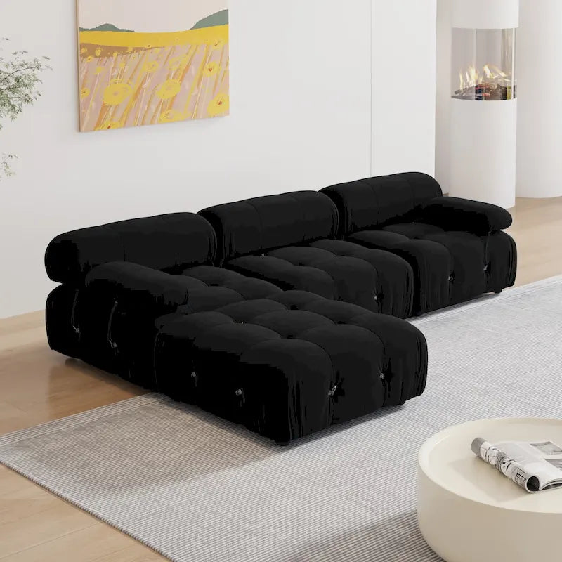 Sofá seccional tapizado en terciopelo negro