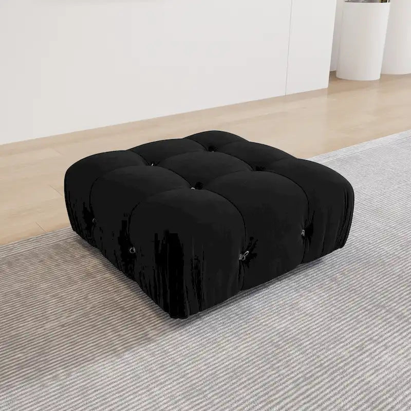 Sofá seccional tapizado en terciopelo negro