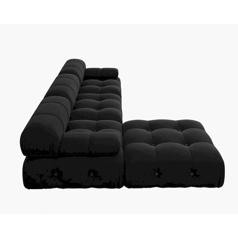 Sofá seccional tapizado en terciopelo negro