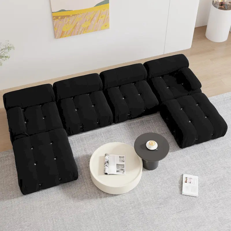 Sofá seccional tapizado en terciopelo negro
