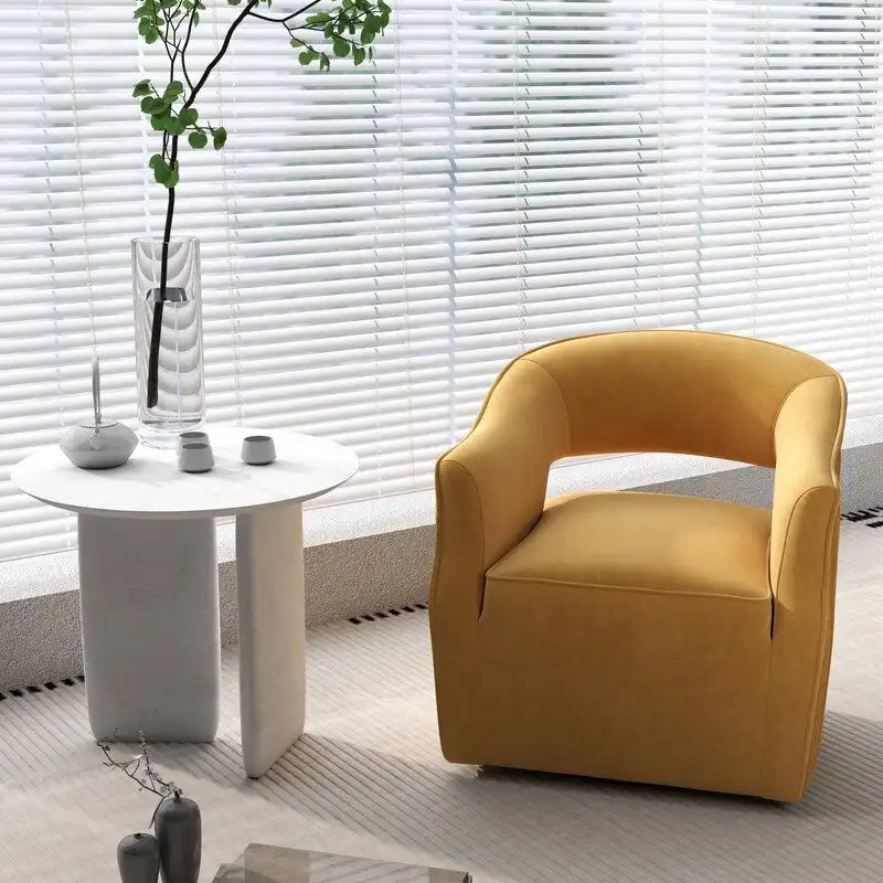 Sillón giratorio decorativo de terciopelo con respaldo abierto y base metálica