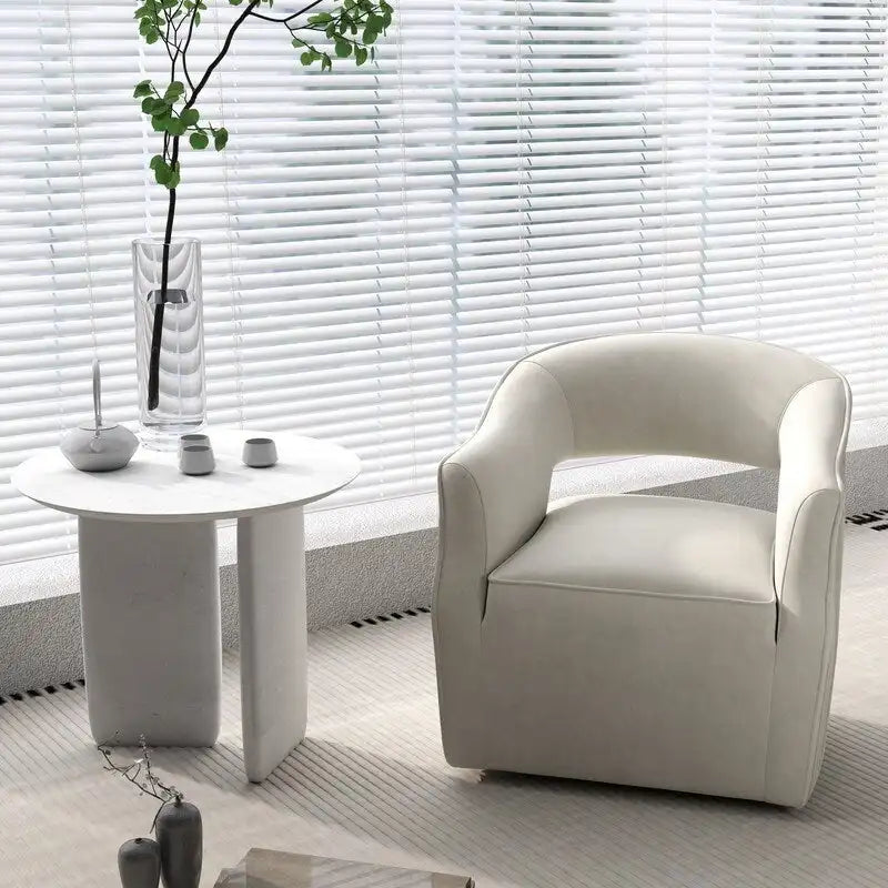 Sillón giratorio decorativo de terciopelo con respaldo abierto y base metálica