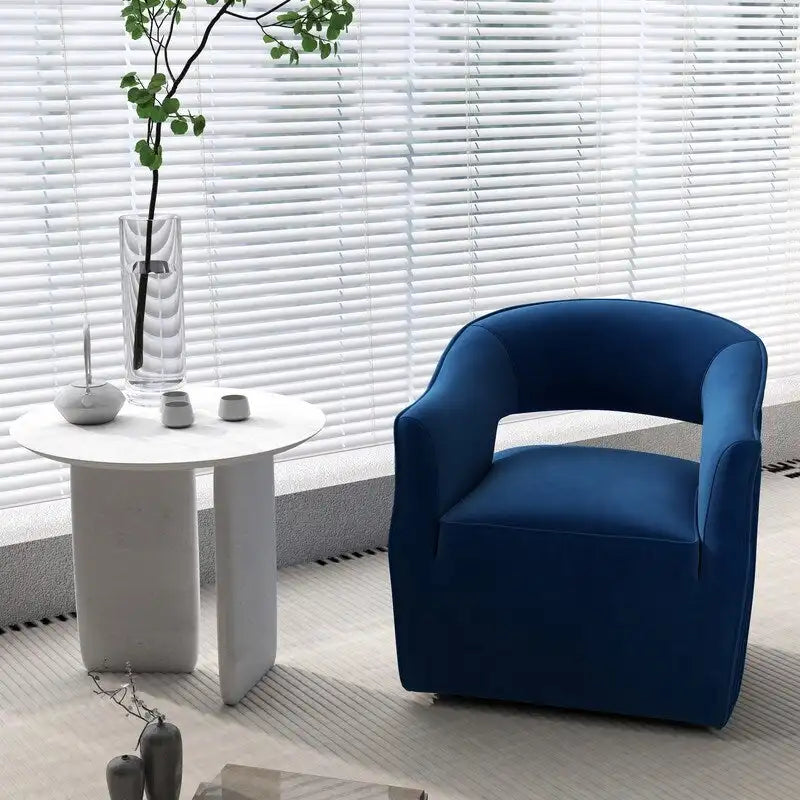 Sillón giratorio decorativo de terciopelo con respaldo abierto y base metálica
