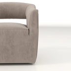 Sillón giratorio decorativo de terciopelo con respaldo abierto y base metálica