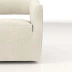 Sillón giratorio decorativo de terciopelo con respaldo abierto y base metálica